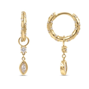 Close-up of gold hoop earrings with marquise-cut crystal and textured diamond finish