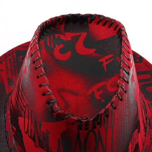 Close-up of red and black graffiti cowboy hat with thick hand-stitched leather edge detail