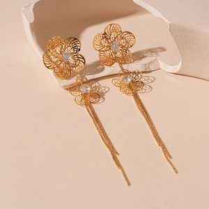 Elegant gold hollow flower tassel earrings with zircons for a sophisticated feminine style