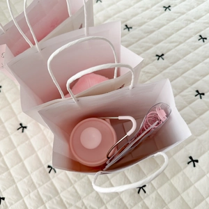 Three white ballet girl gift bags with pink stationery and paper rope handles