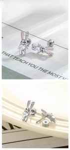 Detail of rabbit stud earrings with pink enamel and heart-shaped cubic zirconia stones