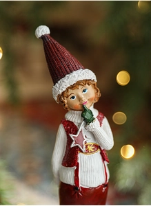 Close-up of resin Santa figurine showing intricate red and white knitted texture detail