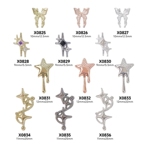 Retro punk nail art charms featuring alloy stars and butterflies in various metallic finishes