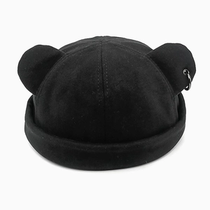 Detail of black dockers hat with cute animal ears and silver metal ring decoration