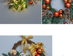 Close-up of Christmas wreath with pine cones, orange baubles and golden LED lights