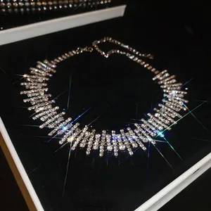 Luxury rhinestone fringe choker necklace with adjustable chain in a black velvet jewelry box