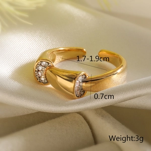 Detail view of gold geometric ring with zircon pavé on white satin showing dimensions