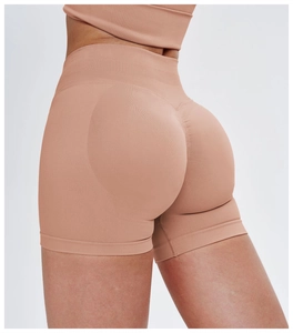 Close-up of seamless scrunch butt detail on high waist nude pink yoga shorts