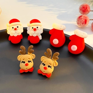 Christmas resin earring set with Santa Claus, reindeer and gloves in festive holiday style