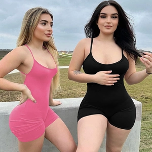 Outdoor shot of models in slim-fit backless rompers in pink and black colors