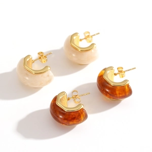 Vintage resin C-shaped hoop earrings in amber and cream white with gold stainless steel