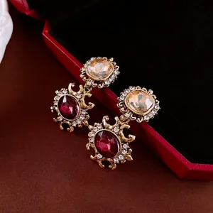 Vintage gold square earrings with red gemstone and crystals in a luxury retro design