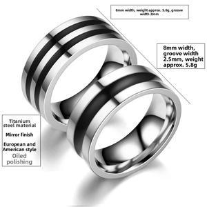 Detail view of 8mm titanium steel rings with black enamel inlay and mirror polish