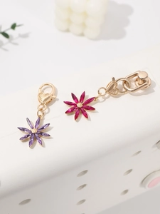 Detail of purple and rose crystal octagonal flower pendants with gold heart lobster clasps