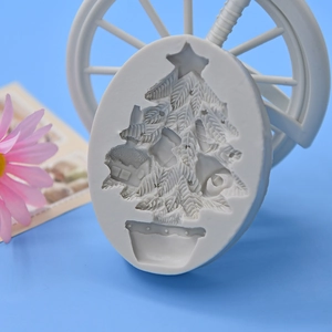 Christmas tree silicone mold for DIY baking and handmade candle making on blue background