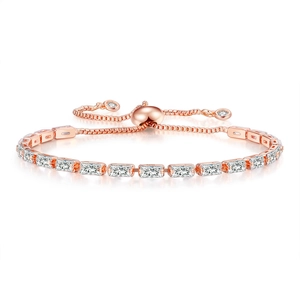Macro detail of rose gold tennis bracelet with rectangular zircons and sliding clasp