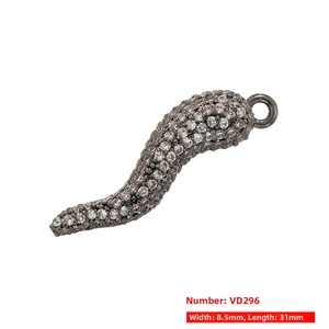 Detail view of a black chili pepper pendant with micro-pave white zircon stones