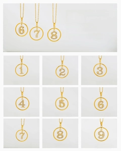 Macro view of gold titanium steel digital pendant necklaces with inlaid zircon details