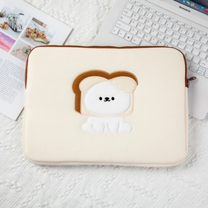 Close-up of cute toast dog embroidery on the padded cream tablet sleeve bag