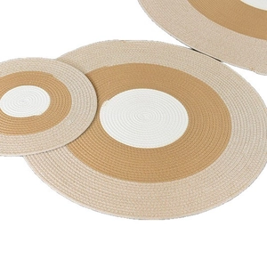Set of three Nordic woven cotton coasters in beige, brown and white with tassels
