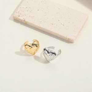 French vintage style heart-shaped open rings in gold and silver finish on stone