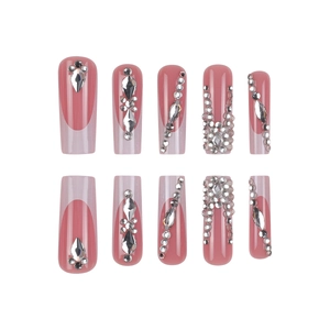 Long pink French press on nails with silver rhinestones and sparkling crystal accents