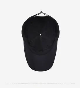 Detail showing the inner structure, seams and adjustable strap of the black quick-dry cap