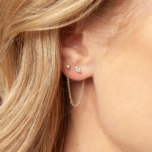 Detailed view of s925 silver eye chain earrings with tassel studs and clear diamonds