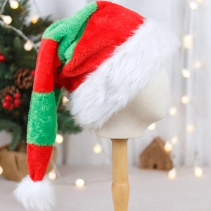 Long red and green striped plush Santa hat with white faux fur trim on a display stand