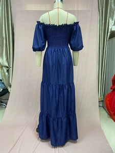 Close-up of the ruffled bodice and off-shoulder neckline on this navy floral dress