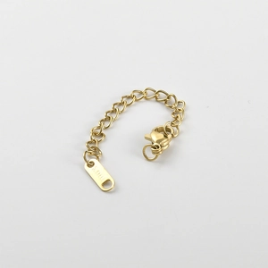 Close-up of golden stainless steel extender chain with lobster clasp for DIY jewelry making