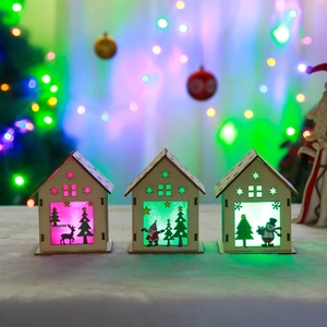 Three glowing Christmas wooden houses with reindeer, Santa, and snowman on snowy base