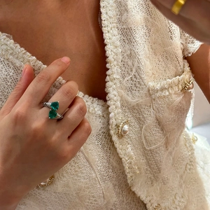 Luxury silver open ring with dual emerald green triangle stones and pave accents