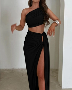 Detail view of black off-shoulder crop top and high slit skirt with elegant ruching