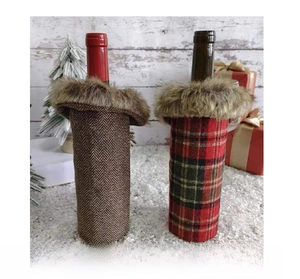 Detailed back view of Christmas plaid wine bottle covers with plush faux fur collars