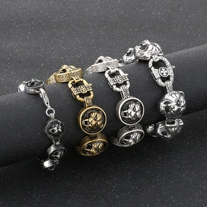 Detail of vintage lion head bracelets in gold, silver and black finishes for men