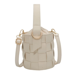 Minimalist woven bucket bag in cream white with top handle and detachable strap