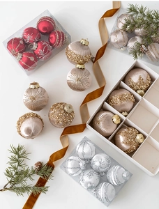 Detail of luxury Christmas tree ornaments with velvet finish and pearl beads in a gift set