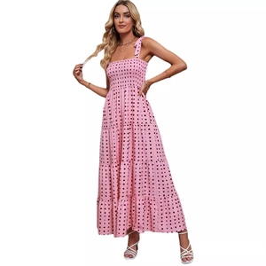 Pink backless maxi dress with black square print and layered ruffled skirt for summer