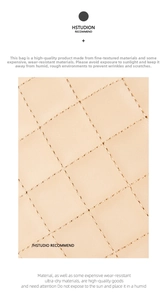 Close-up of beige quilted diamond texture on high-quality synthetic leather bag