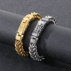Close-up of vintage relief clasp on gold and silver keel chain bracelet for men