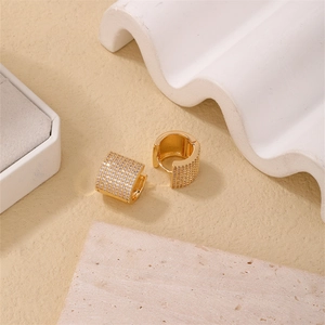 Chic 18K gold plated huggie earrings with pavé set cubic zirconia in a minimalist style