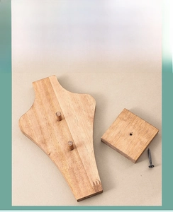 Detailed components of wooden necklace display stand with portrait bust and square base