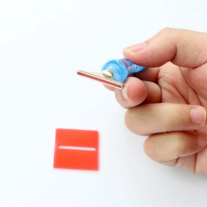 Handheld marble textured diamond painting pen with golden metal tip and red silicone pad