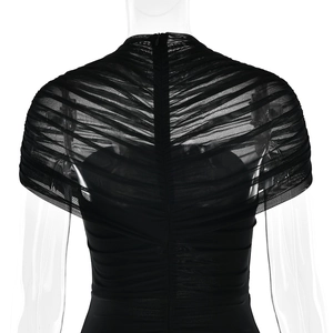 Detail of black mesh ruched back design with zipper closure on a bodycon dress