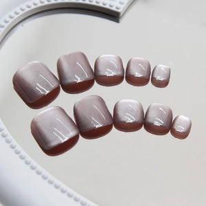 Purple cat eye toe nail press-ons with shimmering pearl finish and 10-piece set display