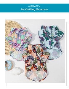 Flat lay of tropical Hawaiian pet shirts in floral, light blue, and orange prints