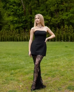 Close-up of black lace texture and semi-sheer fabric on high-waist women's pants