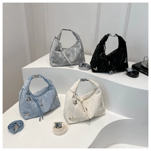 Modern rivet butterfly handbags in four colors with textured fabric and metal hardware