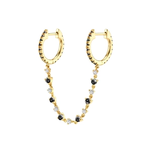 Detailed view of dual-hoop gold earrings with connecting chain and black-white crystals